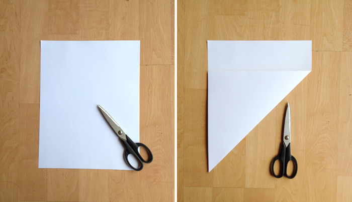 step one of a DIY paper envelope