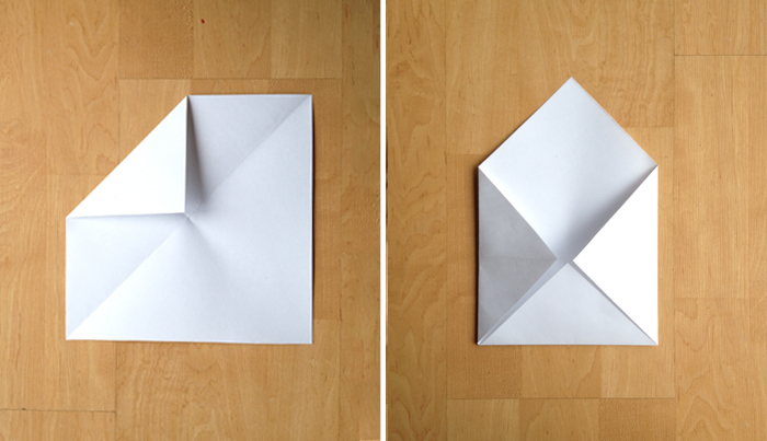 step three of a DIY paper envelope