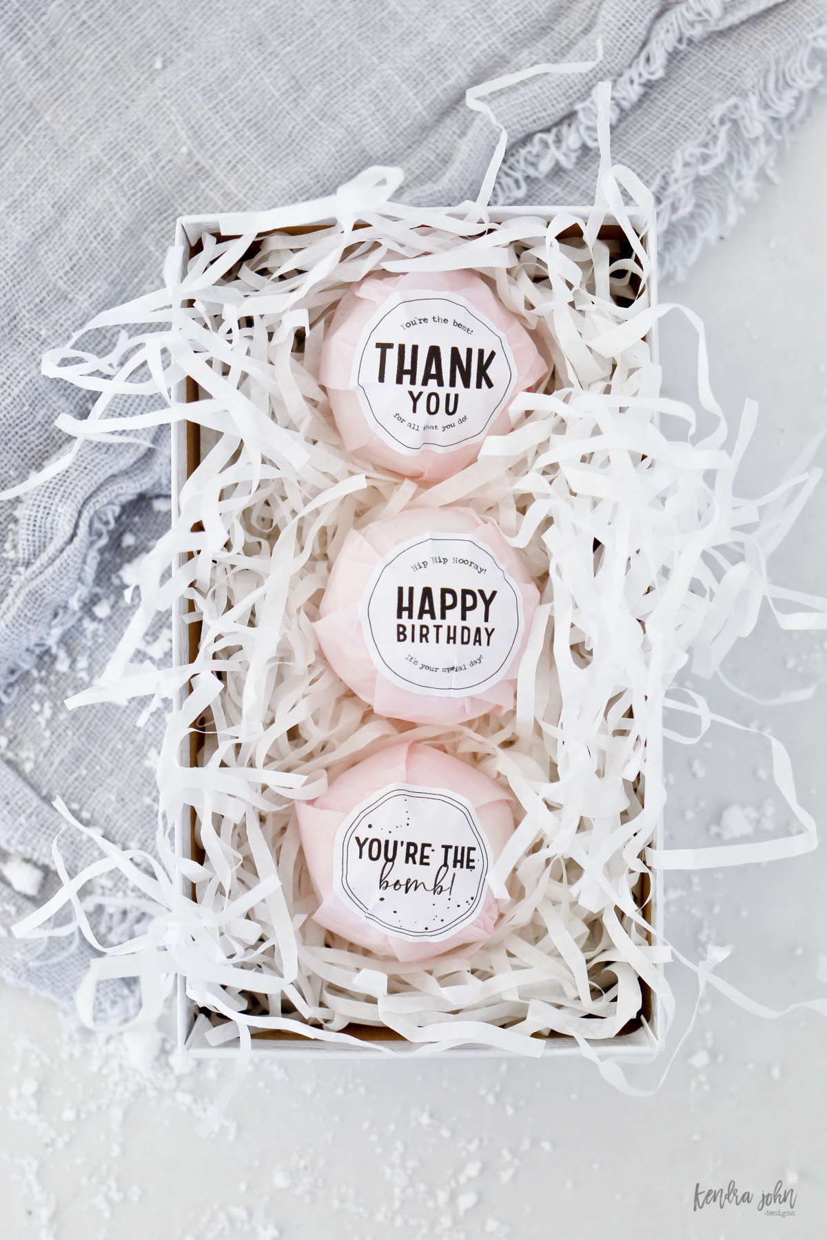 bath bombs in a box with gift tags for thank you, happy birthday, and you're the bomb